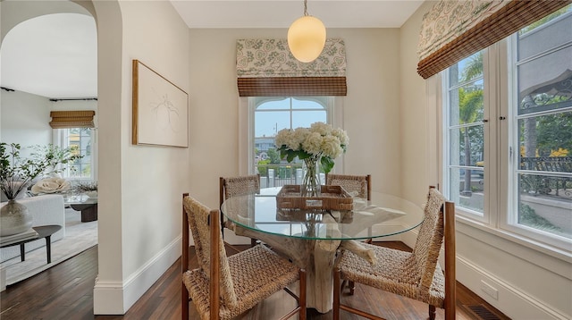 dining space featuring dark hardwood / wood-style floors