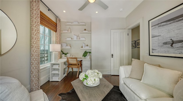 sitting room with dark hardwood / wood-style flooring and ceiling fan