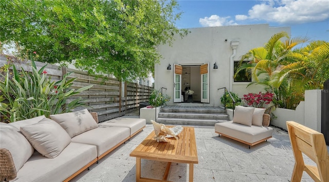 exterior space featuring an outdoor hangout area and a patio