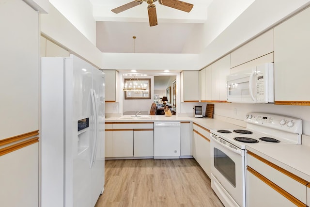 kitchen with sink, light wood-type flooring, ceiling fan, white appliances, and white cabinets