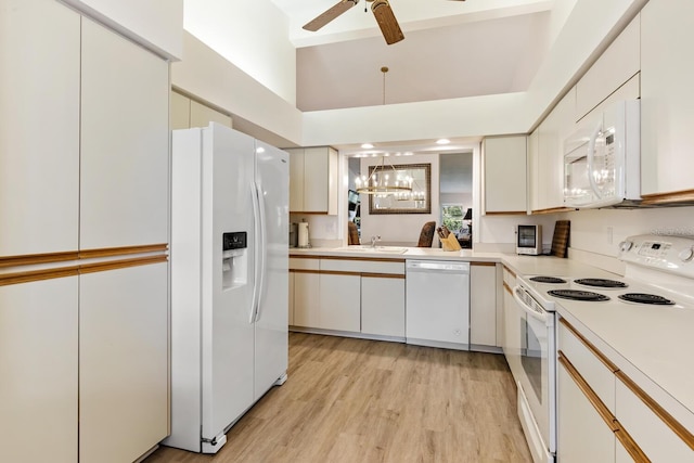 kitchen featuring sink, white appliances, light hardwood / wood-style flooring, ceiling fan, and white cabinets