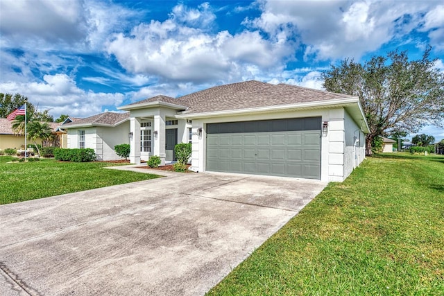 view of front of house featuring a garage and a front lawn