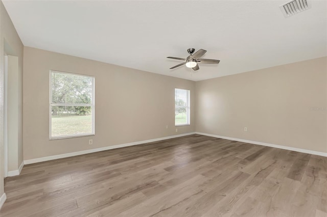 unfurnished room with ceiling fan and light hardwood / wood-style flooring