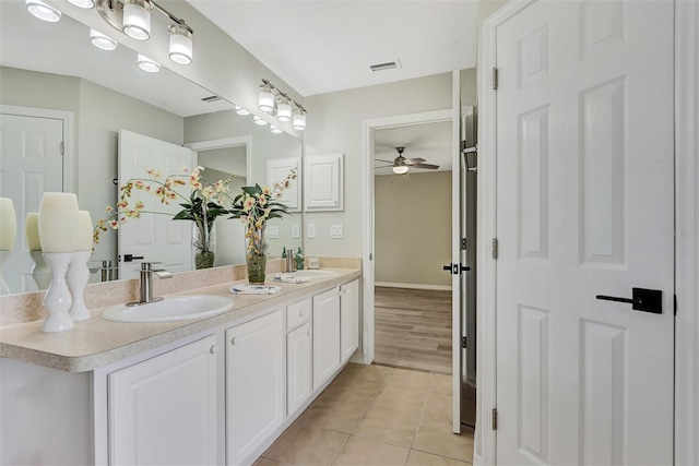 bathroom with ceiling fan, vanity, and tile patterned flooring