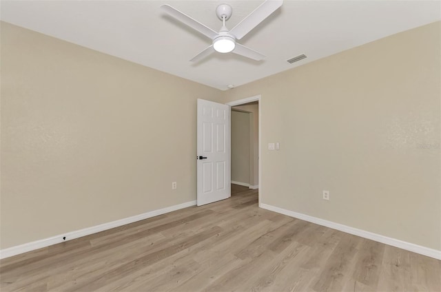 spare room with ceiling fan and light hardwood / wood-style flooring