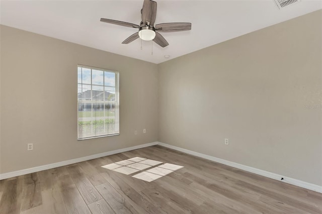 unfurnished room featuring ceiling fan and light wood-type flooring