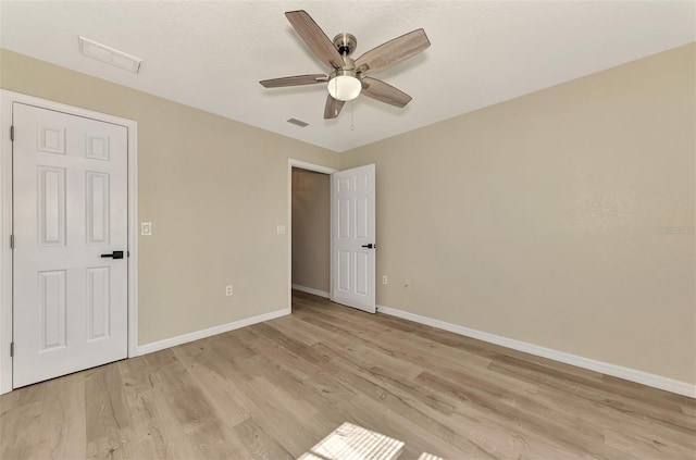 interior space with ceiling fan and light wood-type flooring