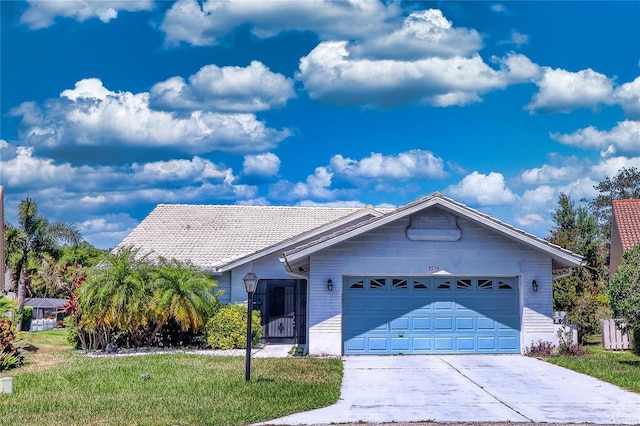 view of front of home with a garage and a front yard