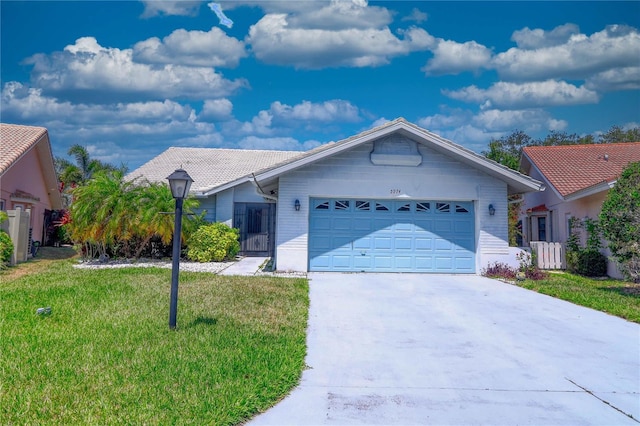 ranch-style home featuring a garage and a front yard