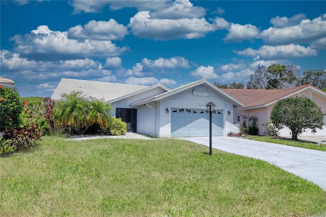 ranch-style home with a garage and a front yard