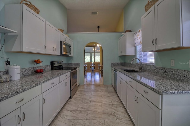 kitchen featuring white cabinetry, sink, and stainless steel appliances