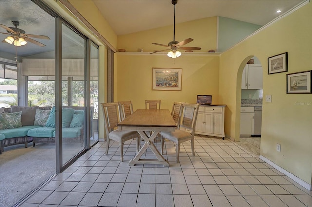 dining room with light tile patterned flooring, lofted ceiling, and ceiling fan