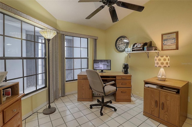 home office featuring lofted ceiling, light tile patterned floors, and ceiling fan