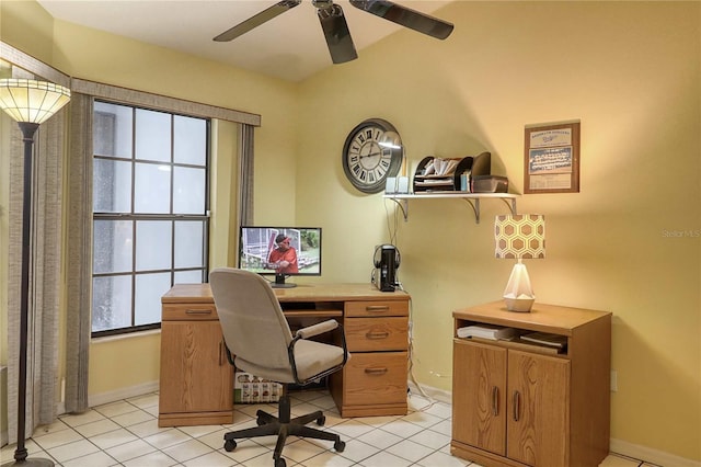 tiled office featuring plenty of natural light and ceiling fan