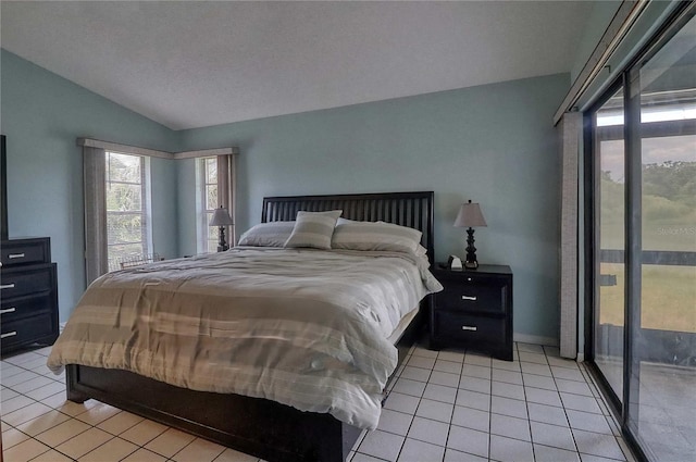 tiled bedroom with lofted ceiling