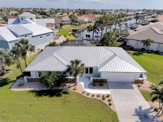 aerial view with a residential view and a water view