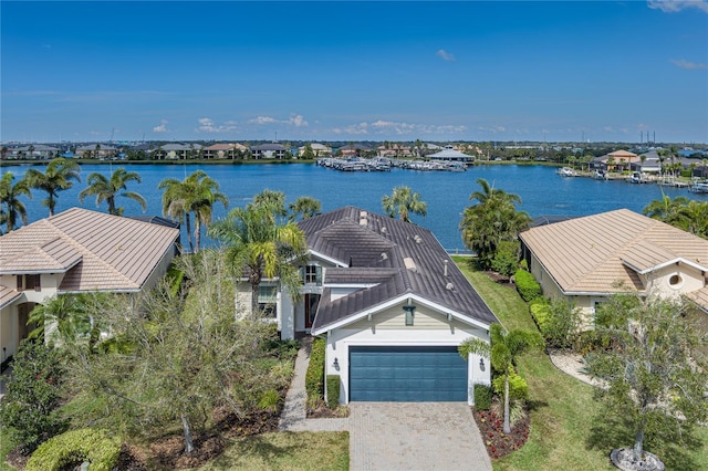 birds eye view of property featuring a water view