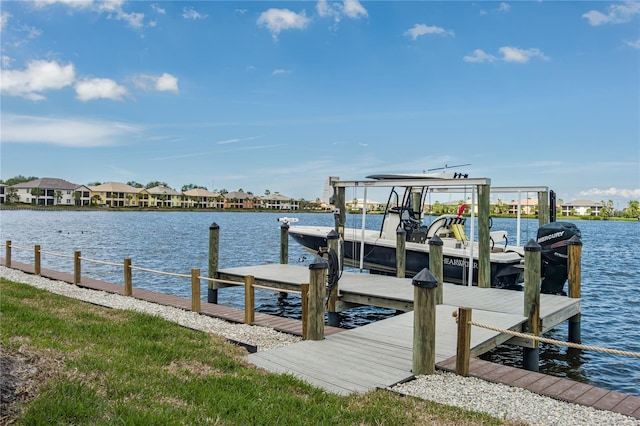 dock area featuring a water view and boat lift