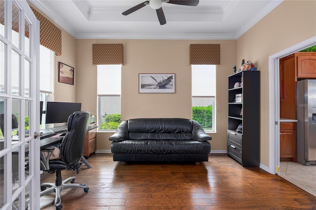 office with a raised ceiling, baseboards, crown molding, and hardwood / wood-style floors