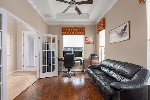 office space with hardwood / wood-style floors, baseboards, french doors, a tray ceiling, and crown molding