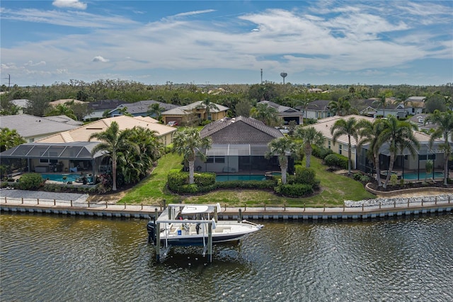 birds eye view of property featuring a residential view and a water view