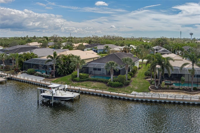 birds eye view of property featuring a water view and a residential view