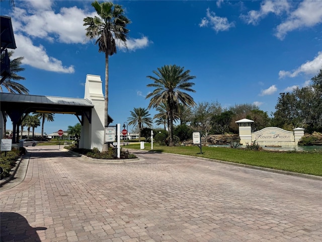 view of street with curbs and traffic signs