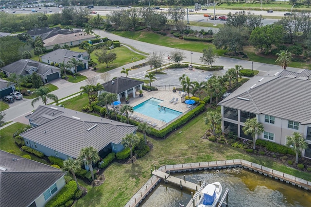 birds eye view of property featuring a water view