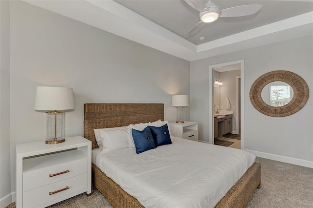 carpeted bedroom with ceiling fan and connected bathroom