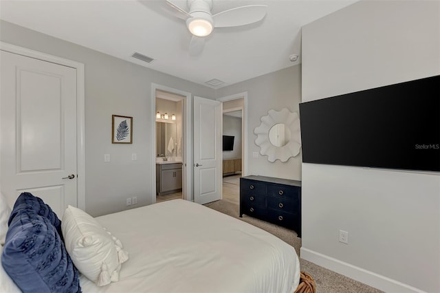 bedroom featuring sink, carpet floors, connected bathroom, and ceiling fan