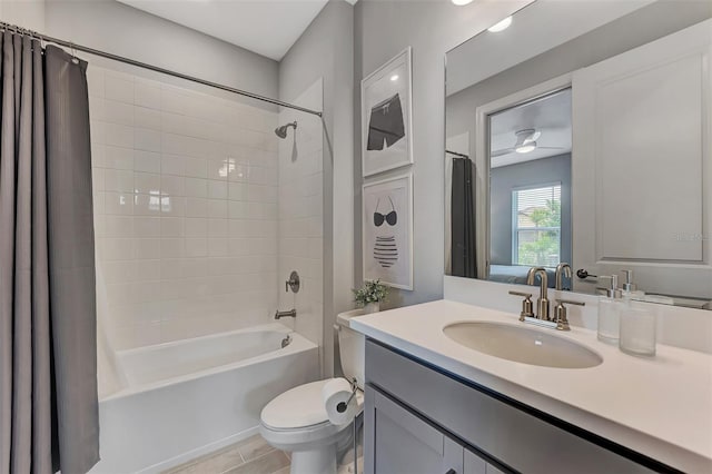 full bathroom featuring vanity, shower / tub combo with curtain, tile patterned floors, and toilet