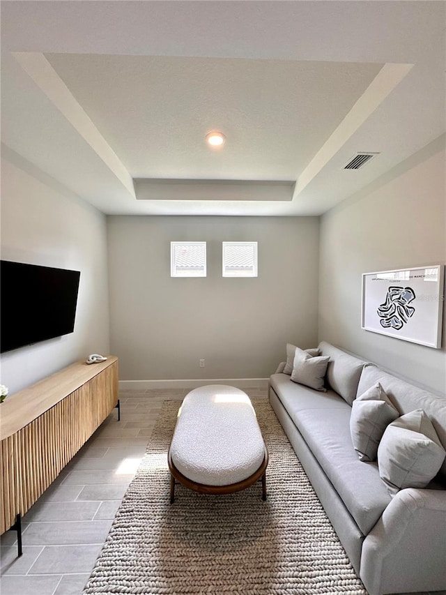 living room with a raised ceiling