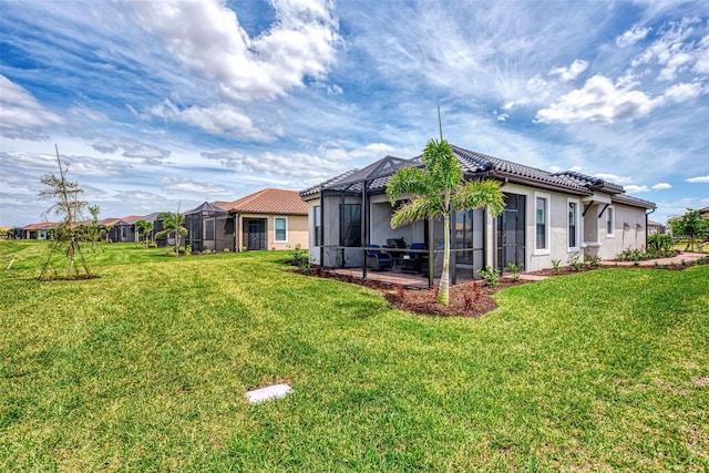 view of yard featuring glass enclosure