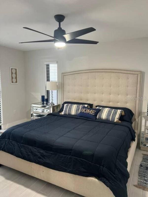 bedroom featuring light wood-type flooring and ceiling fan