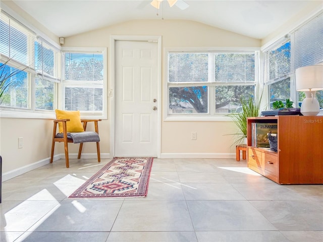 sunroom / solarium with lofted ceiling and ceiling fan