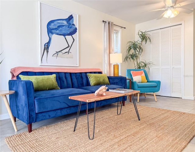 tiled living room with ceiling fan