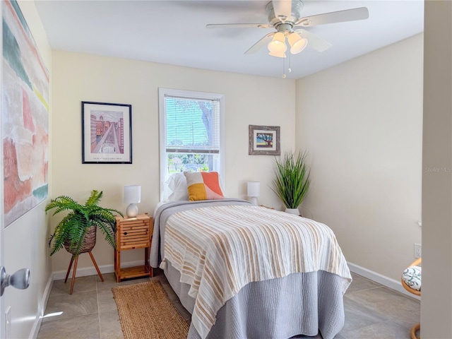 bedroom featuring ceiling fan and light tile patterned floors