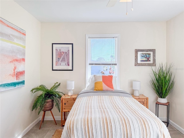 tiled bedroom with ceiling fan