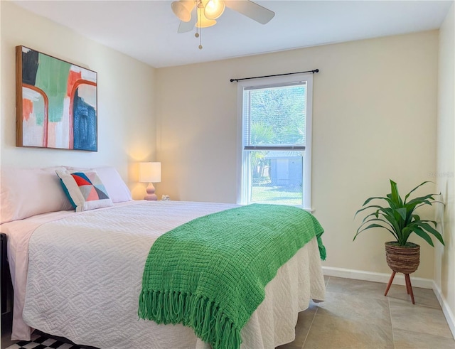 tiled bedroom with ceiling fan