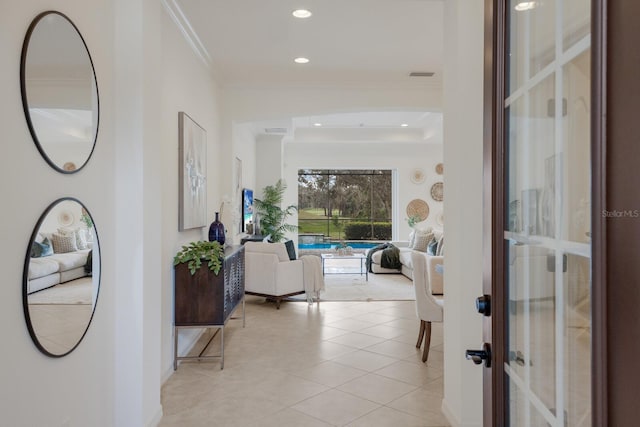 interior space featuring light tile patterned floors, visible vents, crown molding, and recessed lighting