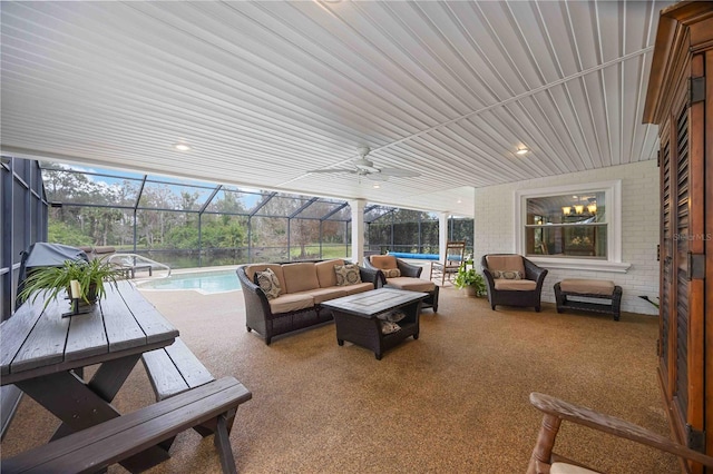 view of patio / terrace with an outdoor hangout area and glass enclosure