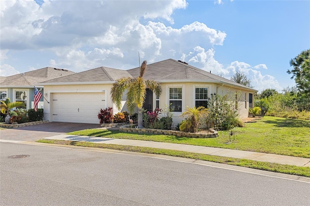 ranch-style home featuring a garage and a front yard