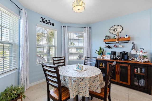 dining area with light tile patterned floors