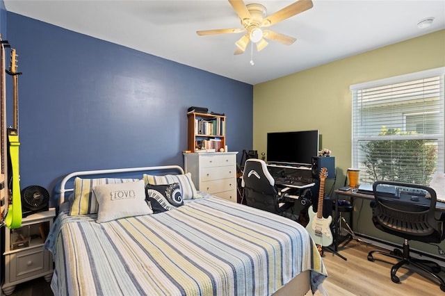 bedroom featuring light hardwood / wood-style floors and ceiling fan