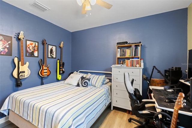 bedroom featuring ceiling fan and light hardwood / wood-style floors