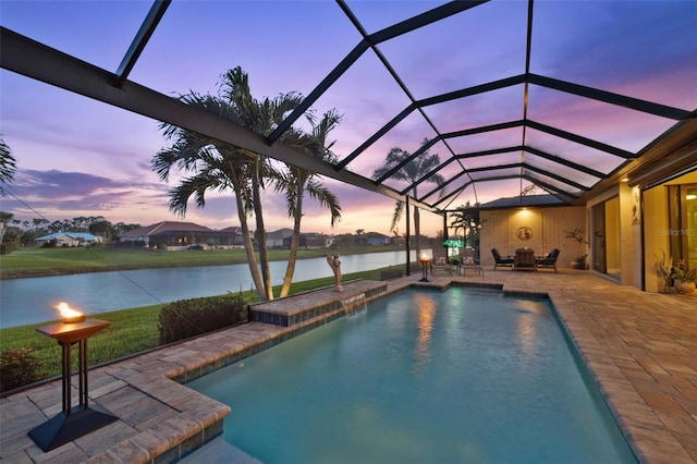 pool with a patio area, a lanai, and a water view