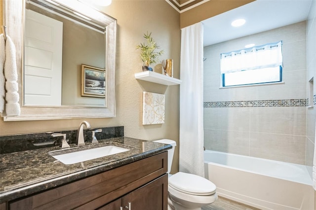 bathroom with vanity, toilet, and shower / bath combo with shower curtain