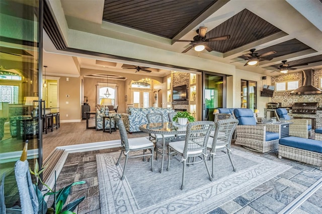 view of patio / terrace with exterior kitchen, outdoor dining area, and an outdoor living space