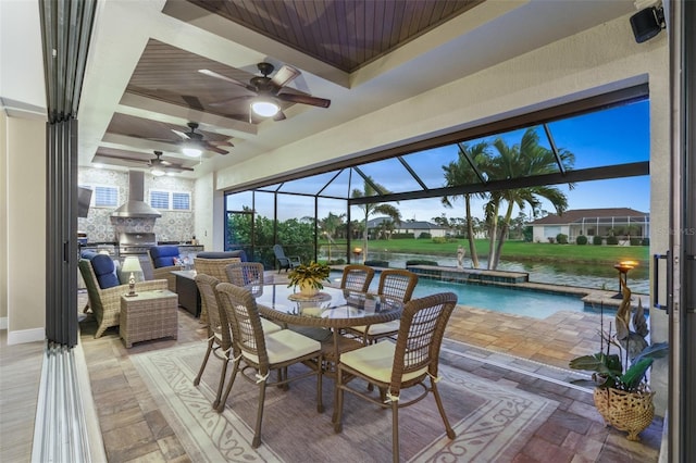 sunroom featuring coffered ceiling and beam ceiling