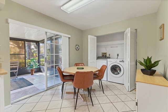 dining area with washer and dryer and light tile patterned floors